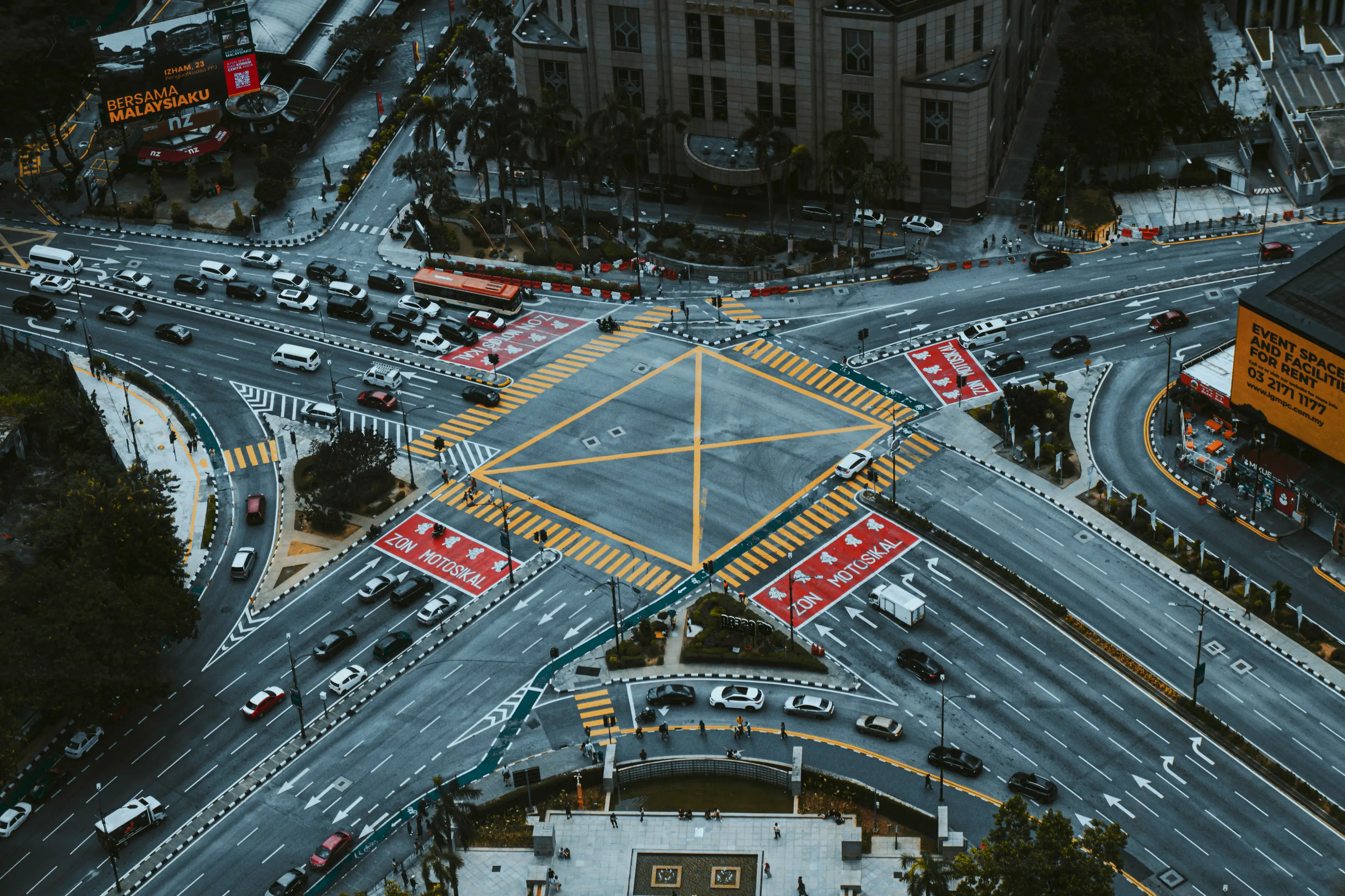 A road junction seen from the air in full daylight.